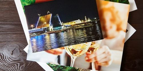 Canvas prints on brown wooden table. Photos with gallery wrap me Canvas prints on brown wooden table. Photos with gallery wrap me