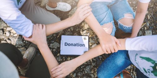 close-up-people-volunteer-teamwork-join-hands-togetherstack-handsunity-teamwork-volunteering-conceptual