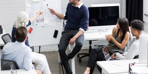 creative-people-sitting-table-boardroom