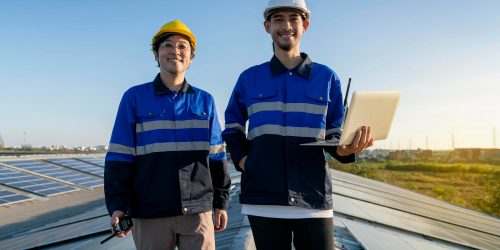 portrait-smiling-professional-engineer-with-laptop-tablet-maintenance-checking-installing-solar-roof-panel-factory-rooftop-sunlight-engineers-team-survey-check-solar-panel-roof portrait-smiling-professional-engineer-with-laptop-tablet-maintenance-checking-installing-solar-roof-panel-factory-rooftop-sunlight-engineers-team-survey-check-solar-panel-roof